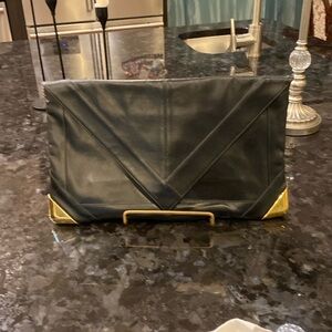 Black leather clutch with attached mirror and change purse
